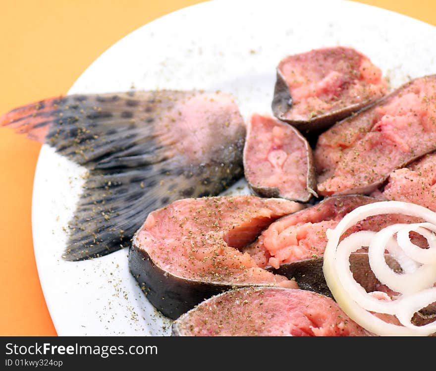 A fresh salmon and some salmon steaks. A fresh salmon and some salmon steaks