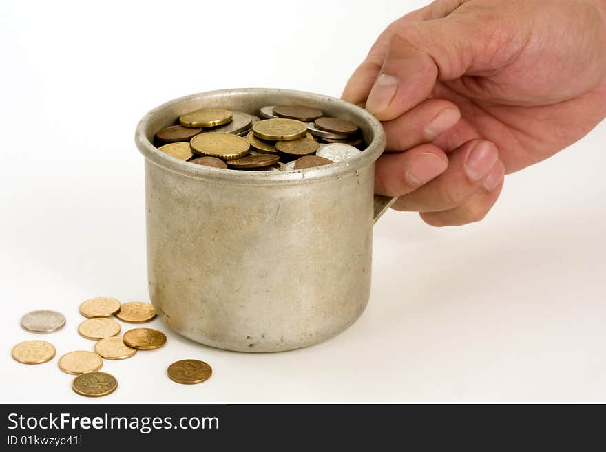 Old aluminum mug and coins.