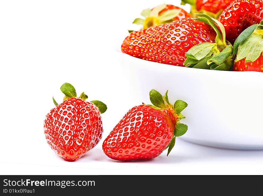 Strawberry in a bowl on the white background