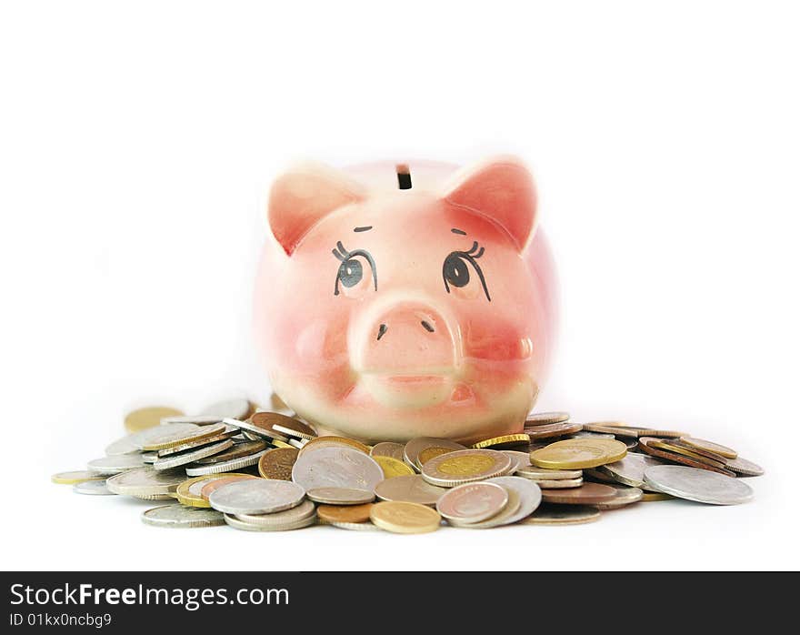 Pink piggy bank isolated on white background with coins