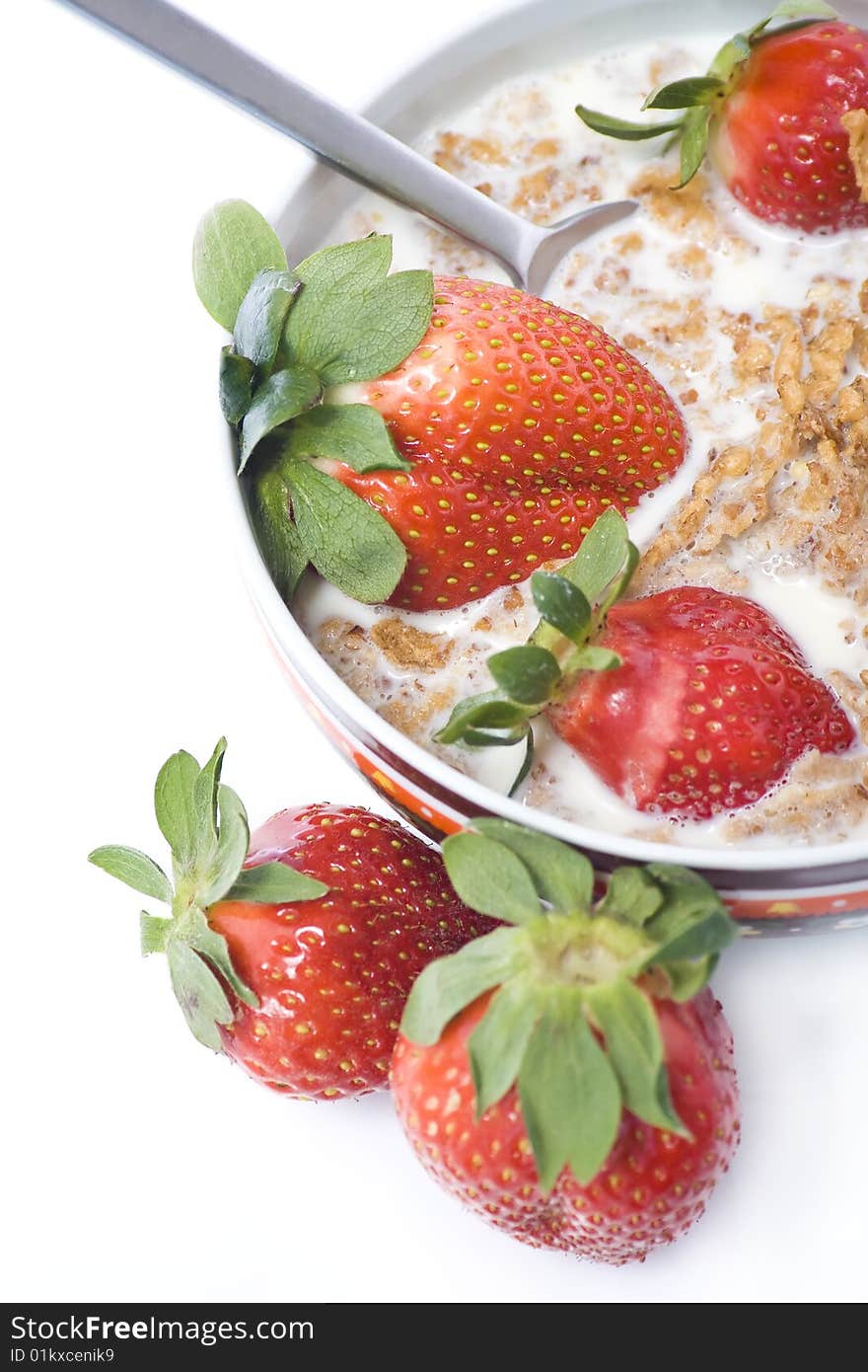 Bowl of cereal with milk and strawberrys. Bowl of cereal with milk and strawberrys