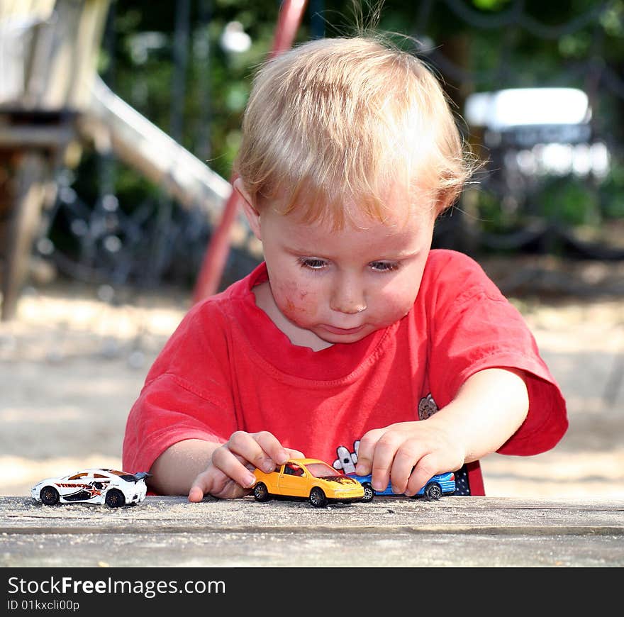 A sweet boy is playing on the playground