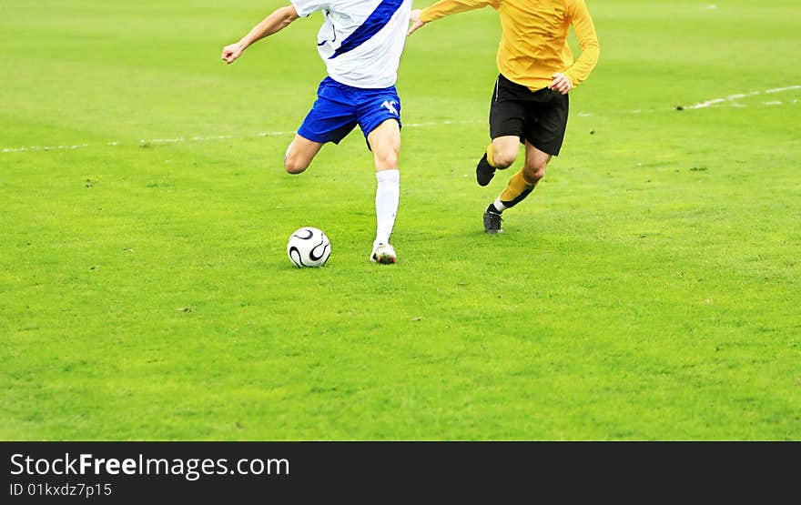 Details of soccer match with two players in action