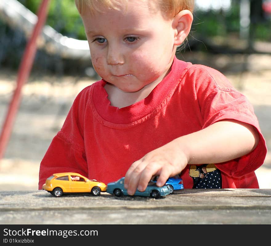 A sweet boy is playing on the playground