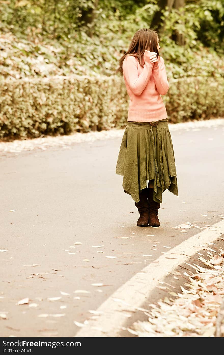 Young worried woman in the street. Young worried woman in the street.