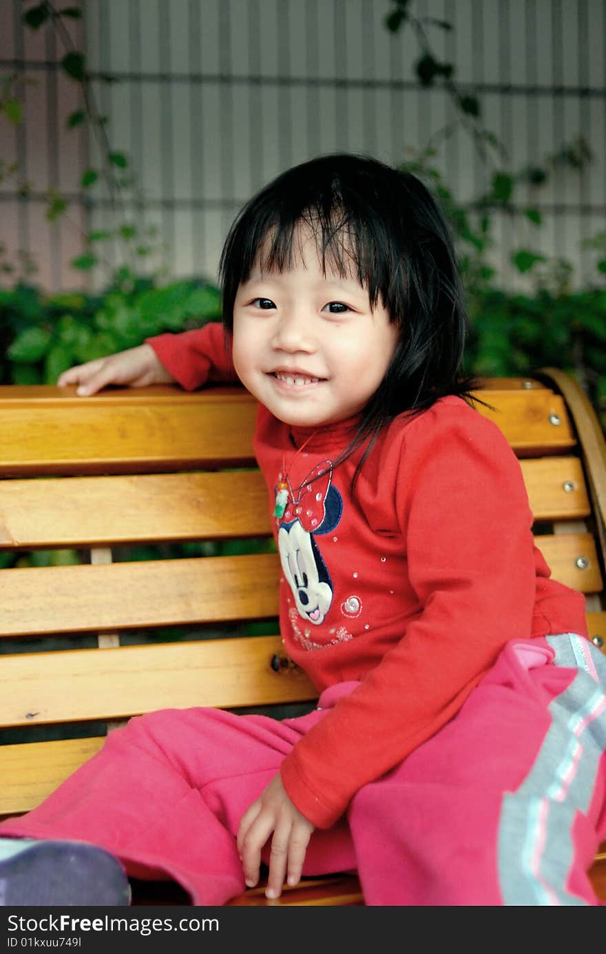 Asian child smile on the stool