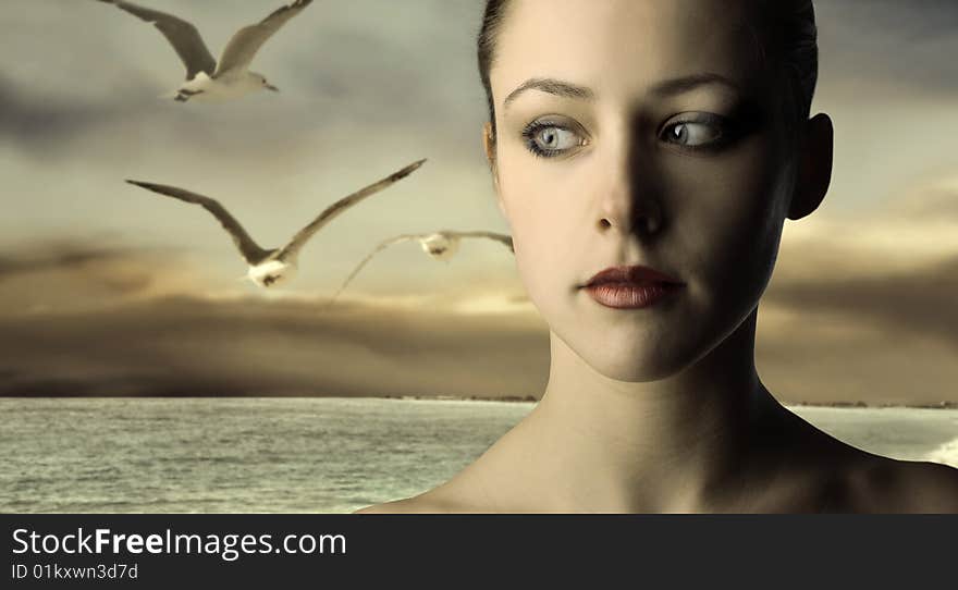 Portrait of a beautiful woman at the sea