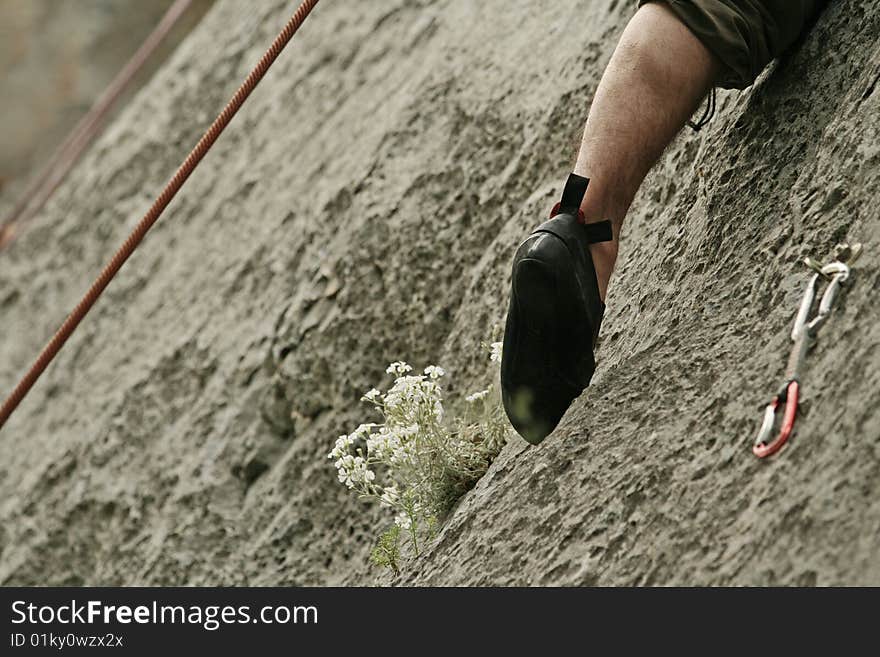 Young man climbing on rocks. Young man climbing on rocks