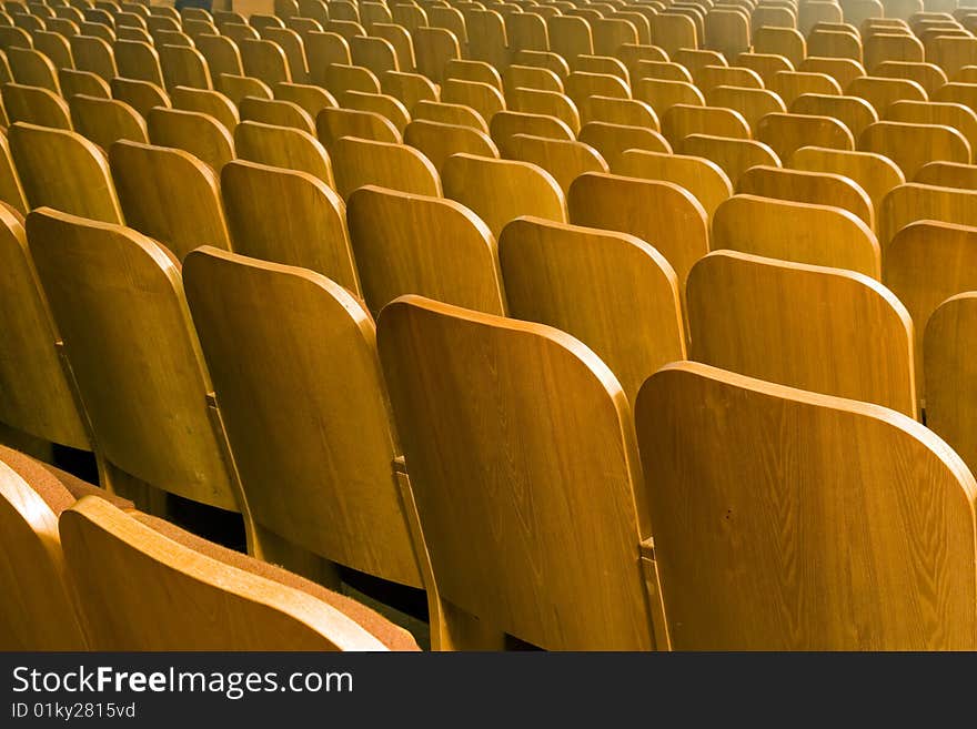 An empty old fashioned movie theater or conference hall. An empty old fashioned movie theater or conference hall.