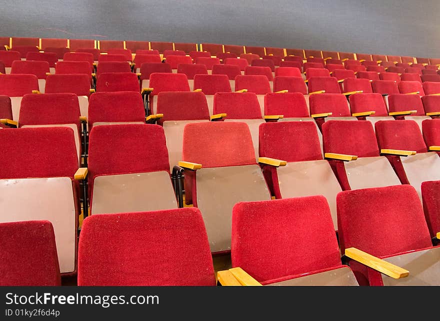 An empty old fashioned movie theater or conference hall. An empty old fashioned movie theater or conference hall.