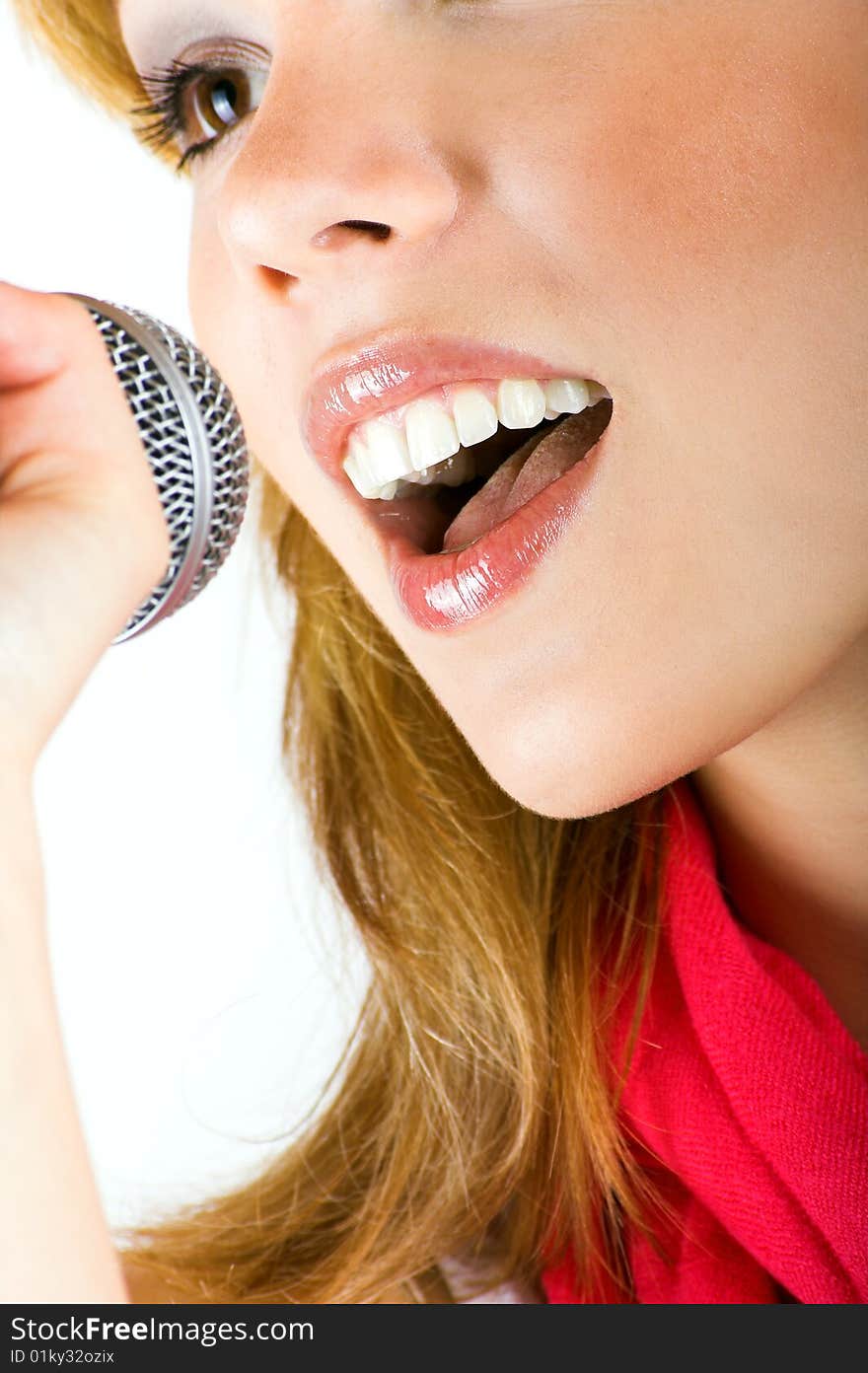 Portrait of a happy singing woman with a microphone. Portrait of a happy singing woman with a microphone