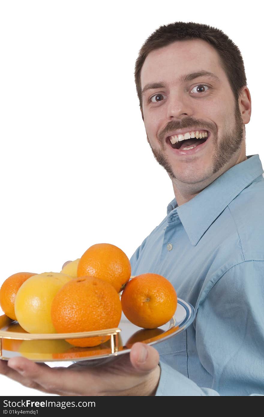 Young Man Serving Fruit With Big Smile