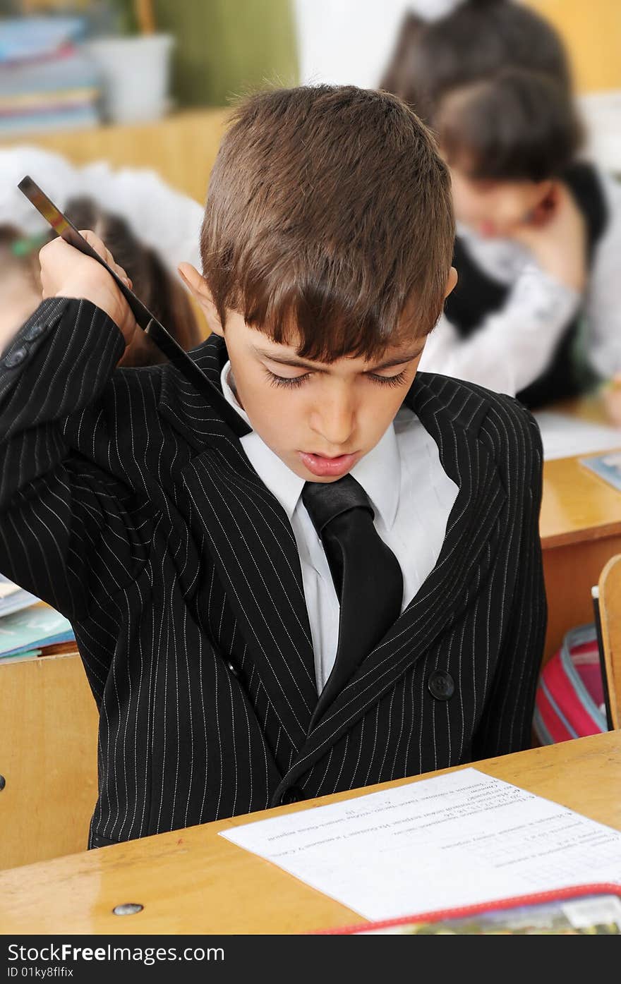 The schoolboy at a lesson at school.