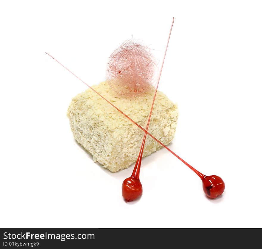 Biscuit cake with two lollipops on the white background. Biscuit cake with two lollipops on the white background