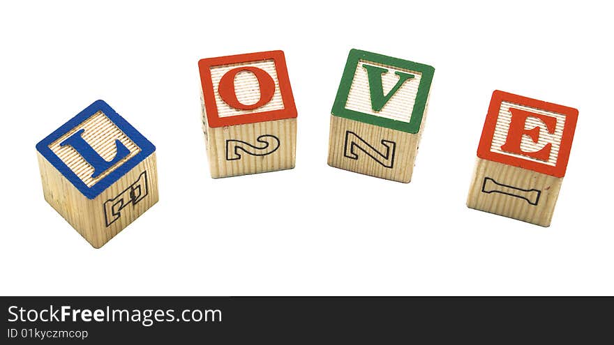 The letters L-o-v-e spelled out in child's building blocks over white. The letters L-o-v-e spelled out in child's building blocks over white