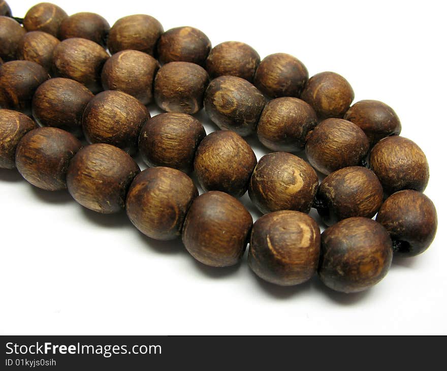 Wooden rosary isolated on a white background.