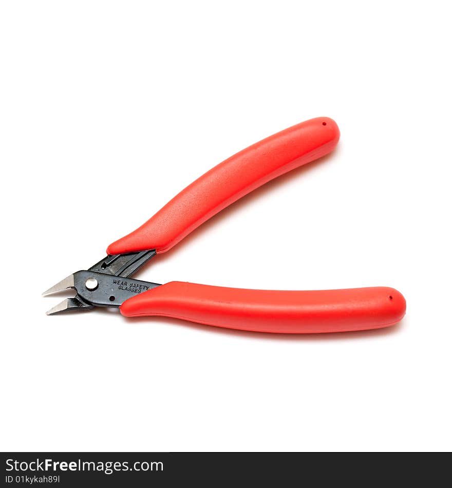 Electrical or fine side cutters with red handles on isolated white background