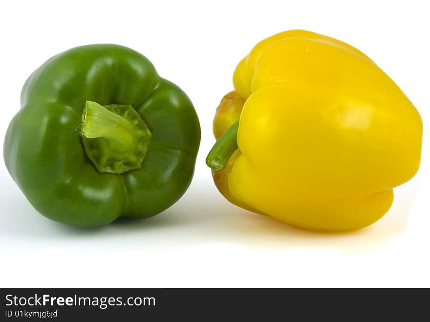 Yellow and green bell peppers isolated on white background. Yellow and green bell peppers isolated on white background