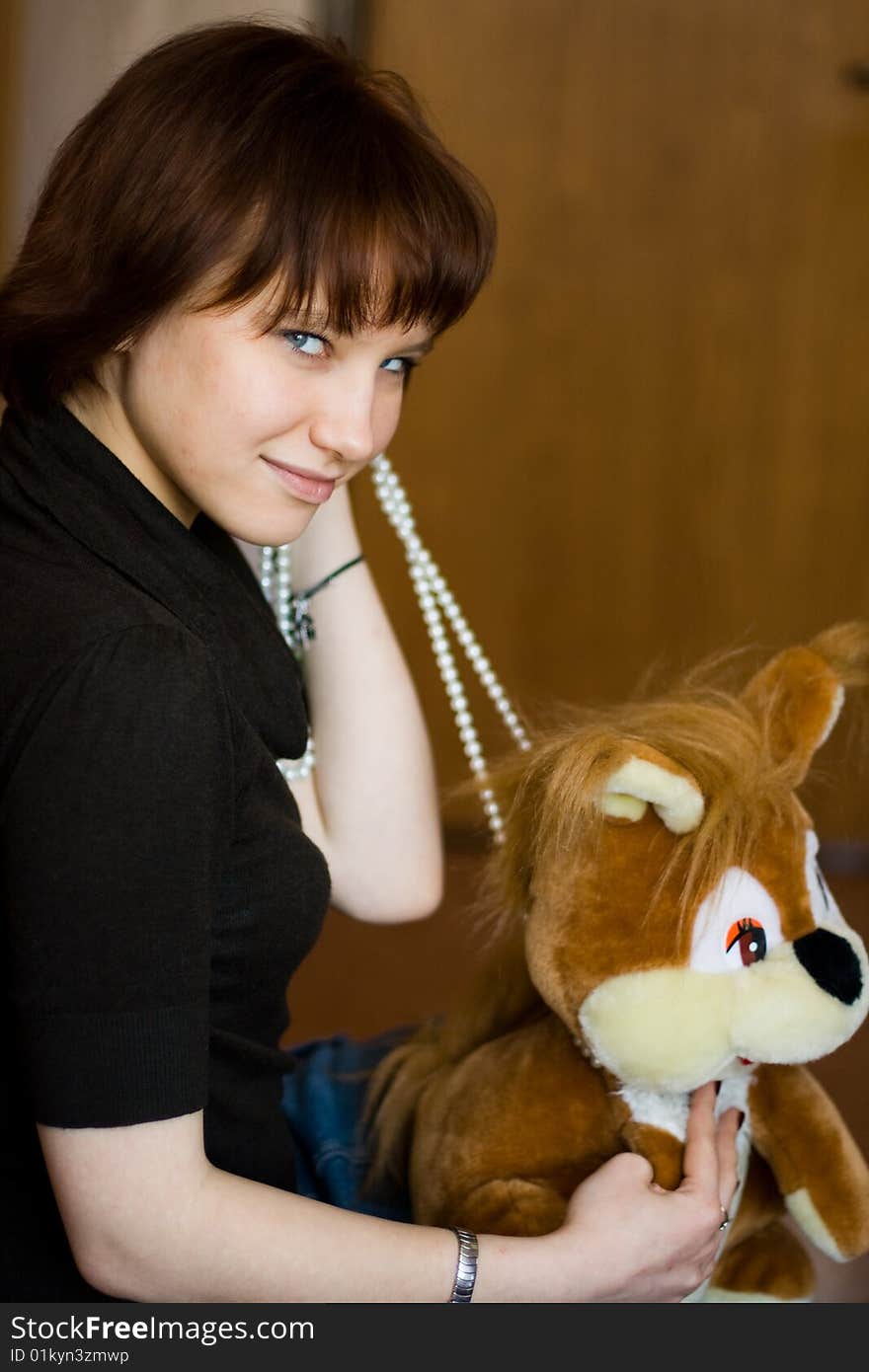 A girl holds a red squirrel. A girl holds a red squirrel