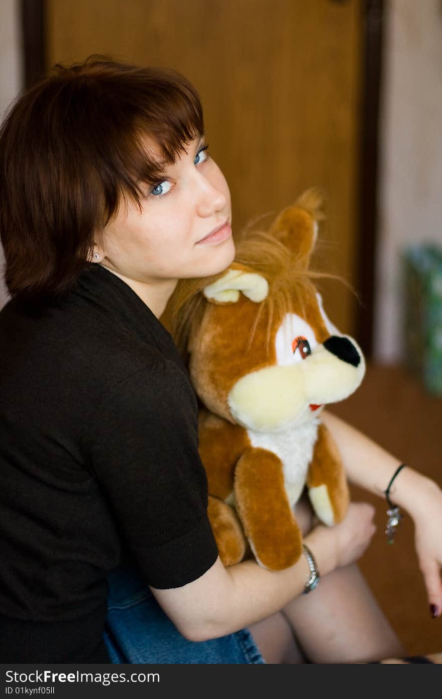 A girl holds a red squirrel. A girl holds a red squirrel