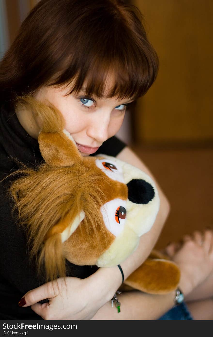 A girl holds a red squirrel. A girl holds a red squirrel