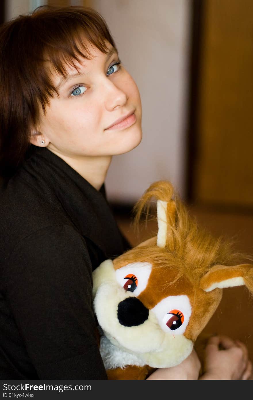 A girl holds a red squirrel. A girl holds a red squirrel