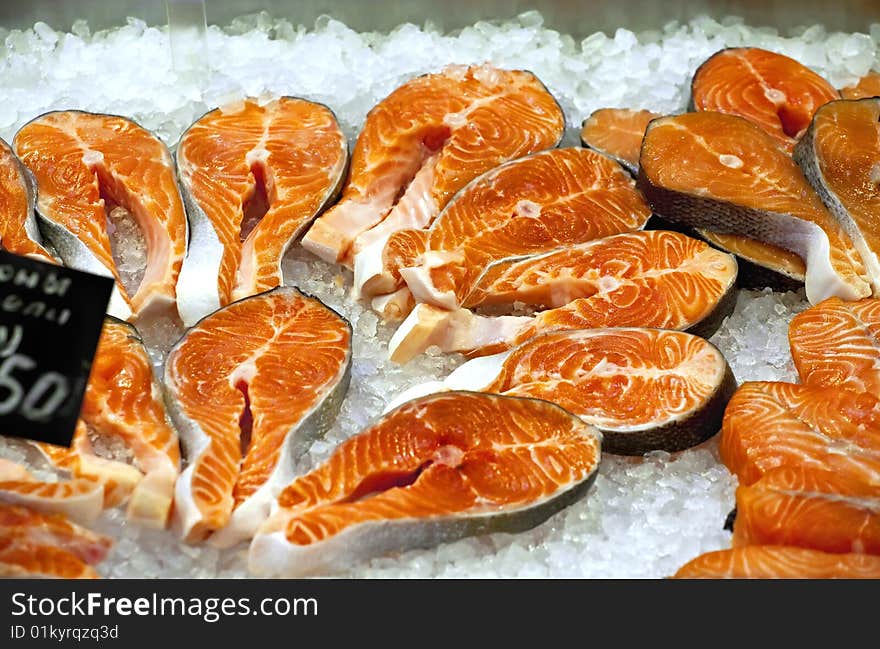 Appetizing pieces of red fish in the fish market