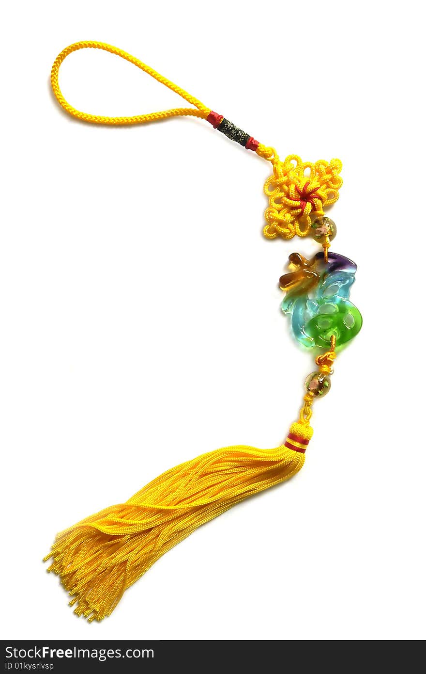 A chinese traditional knot with golden tassel and chinese letterhappy which made of coloured glaze. A chinese traditional knot with golden tassel and chinese letterhappy which made of coloured glaze.