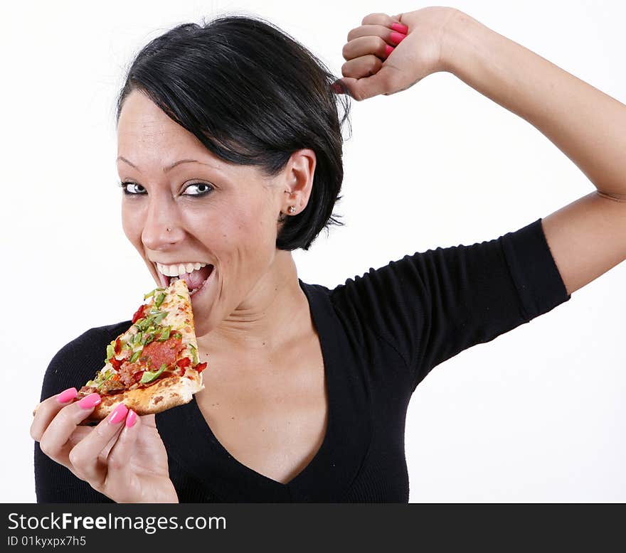 Sweet and pretty girl eating pizza slice