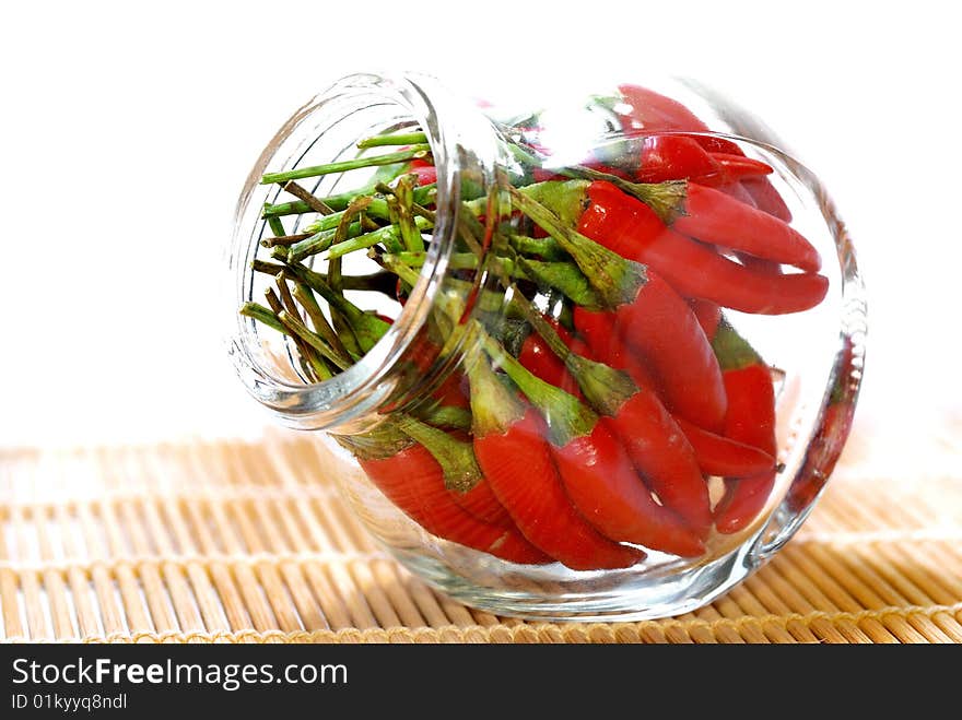 Close up capture red spicy chili on white background. Close up capture red spicy chili on white background