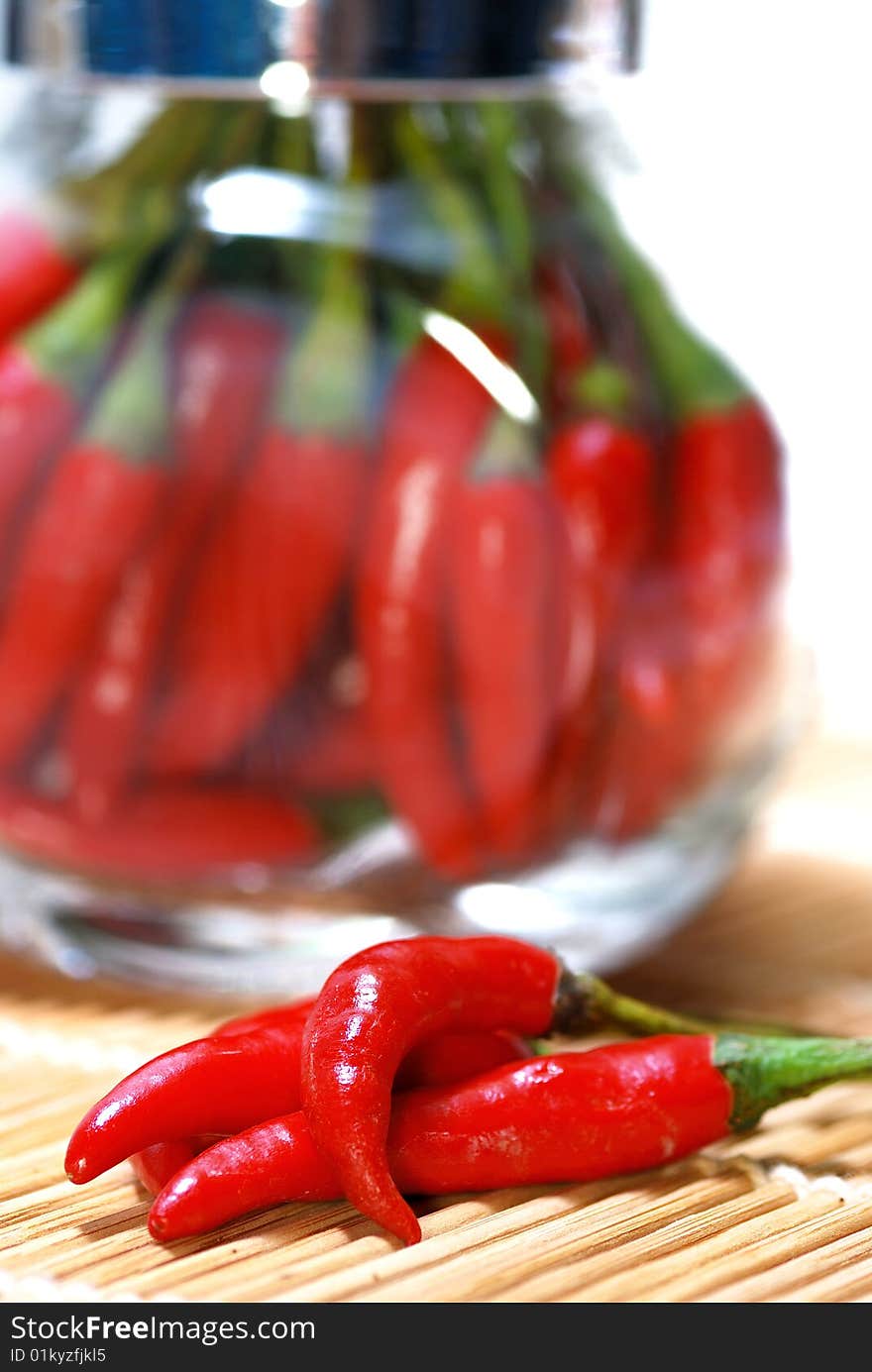 Close up capture red spicy chili on white background. Close up capture red spicy chili on white background