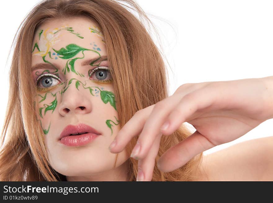 Portrate of young girl witn faceart, moving a hand