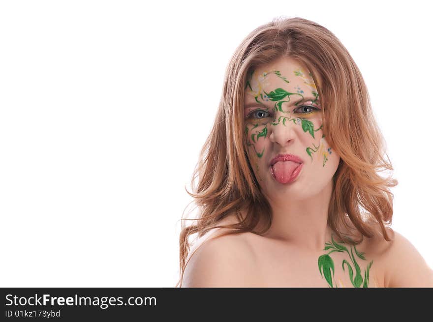 Redhead girl witn faceart, showing her tonque