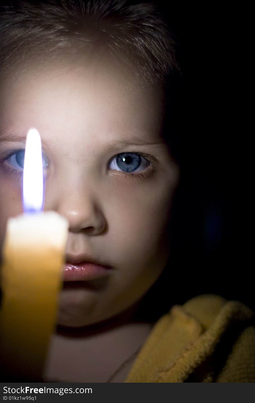 Portrait of the girl with a candle in hands. Portrait of the girl with a candle in hands.