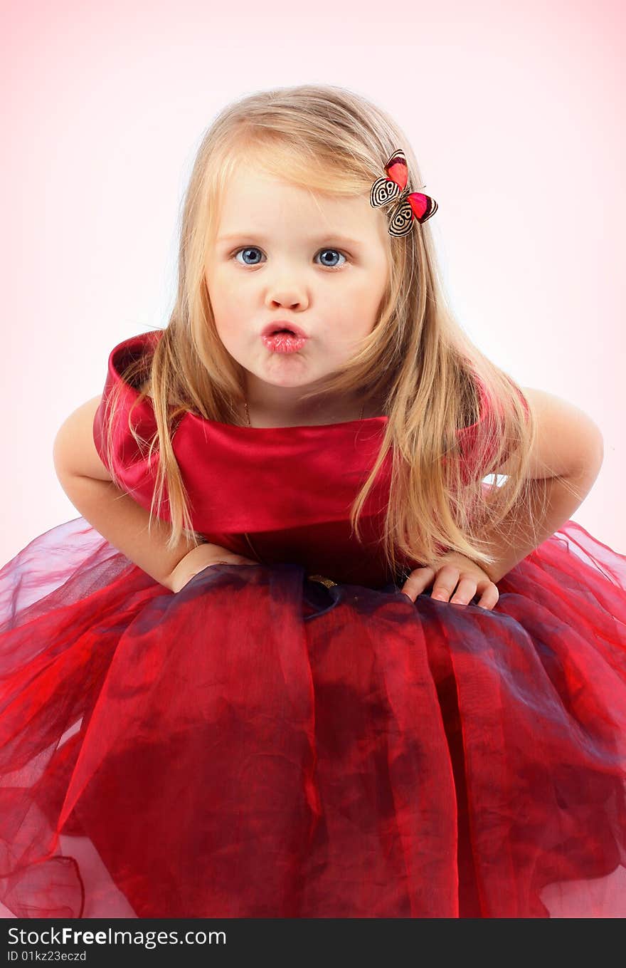 Portrait of the beautiful girl in a red dress. Portrait of the beautiful girl in a red dress