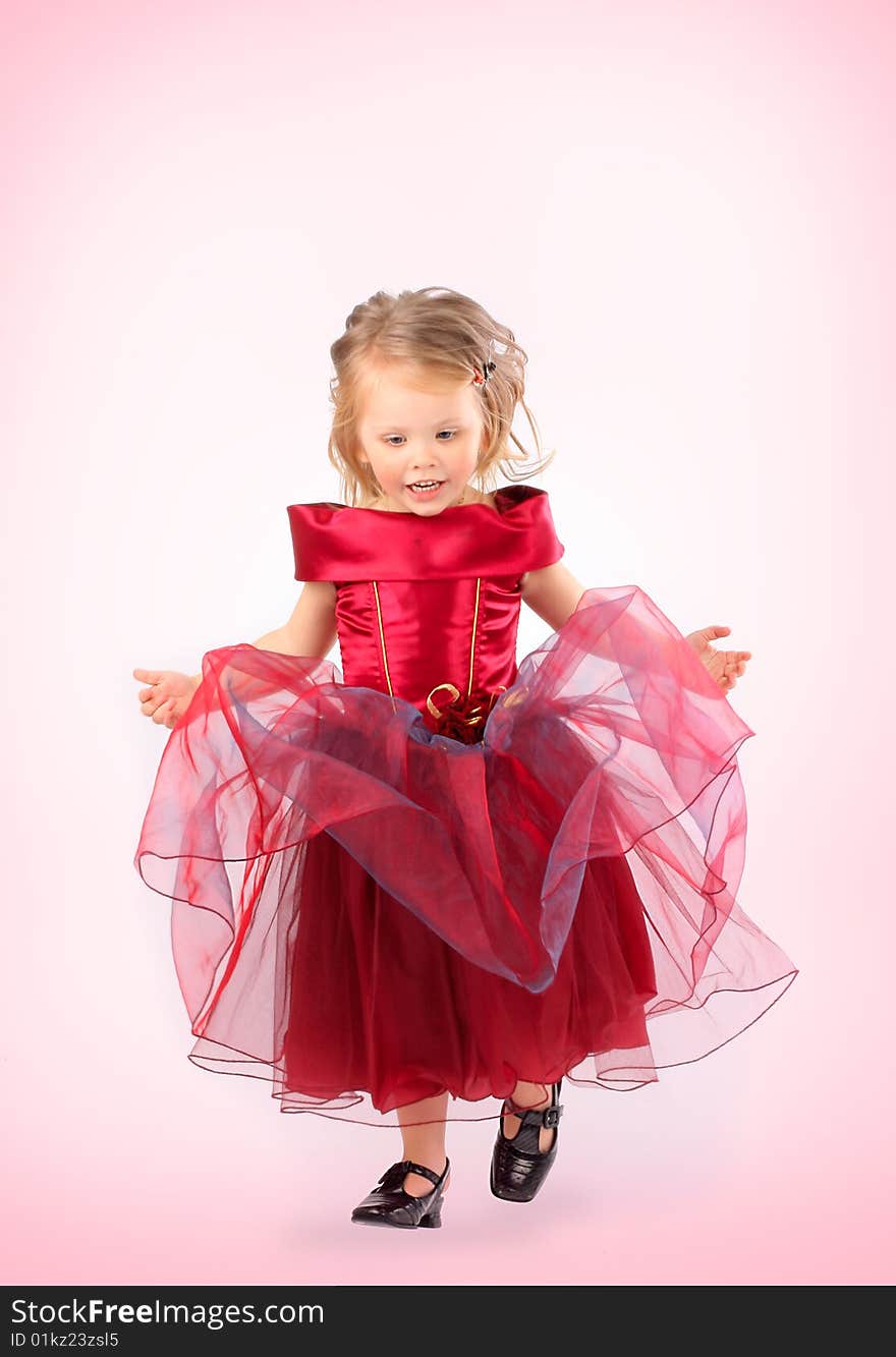 Portrait of the beautiful girl in a red dress. Portrait of the beautiful girl in a red dress