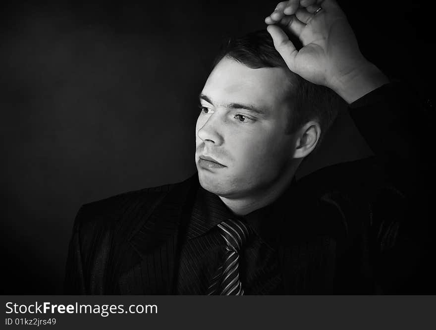 Young man on a black background