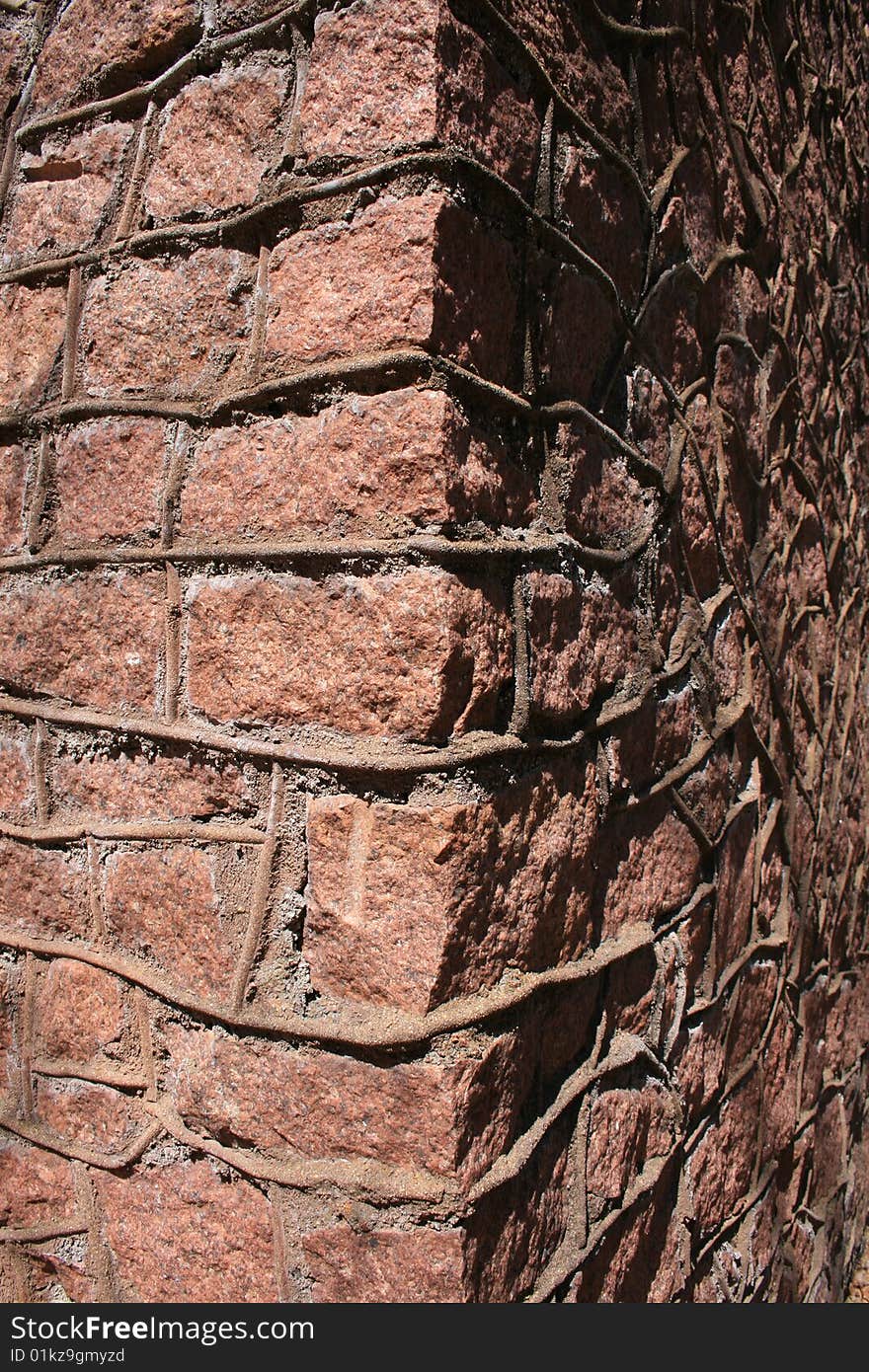 Old ruins of structure with stone construction cropped around corner. Old ruins of structure with stone construction cropped around corner