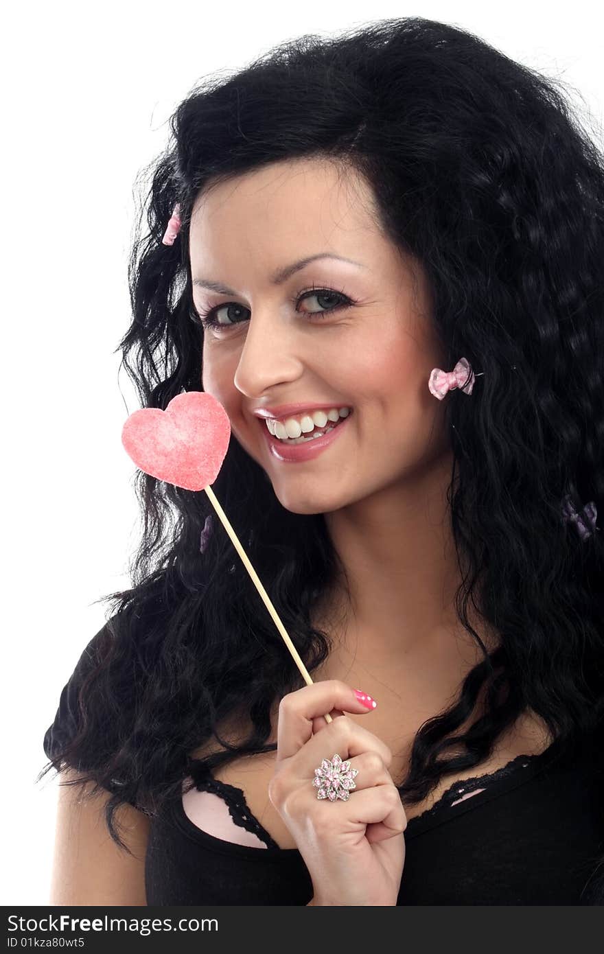 Beautiful lady holding a heart lollipop. Beautiful lady holding a heart lollipop.