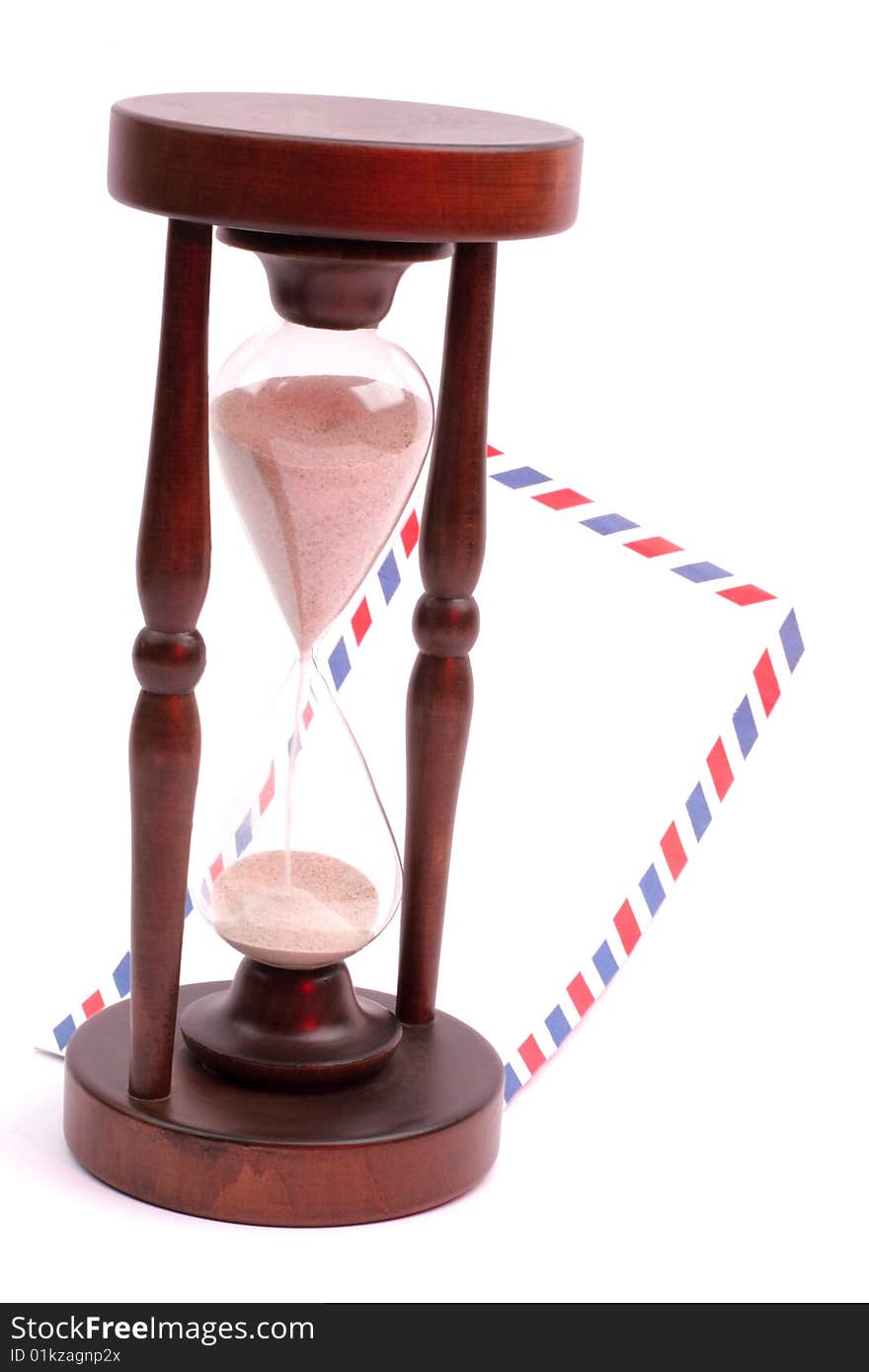 Letter and hourglass in red light