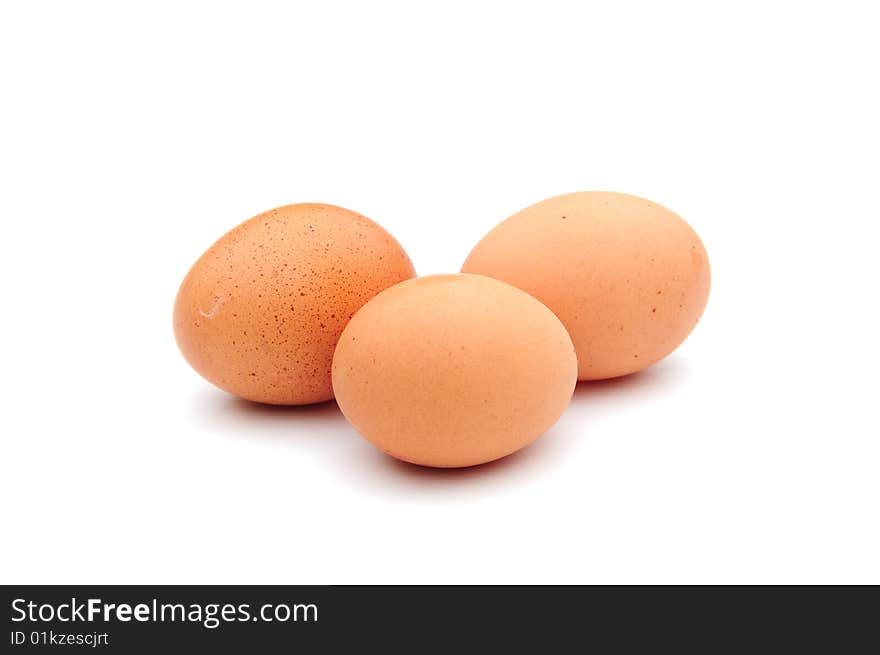 Shot of three fresh eggs on white