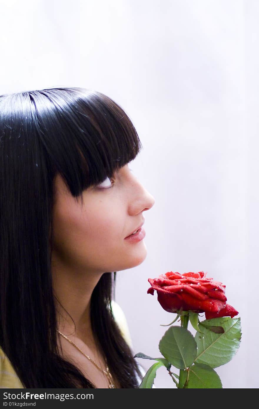 Girl with beautiful flower - red rose. Girl with beautiful flower - red rose