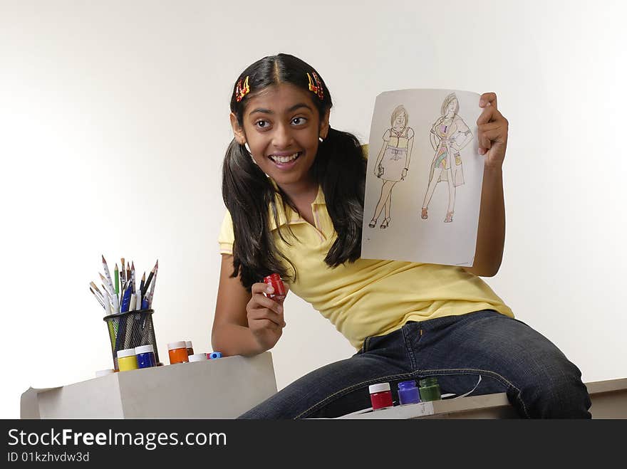 Beautiful girl showing art of fashion designing. Beautiful girl showing art of fashion designing