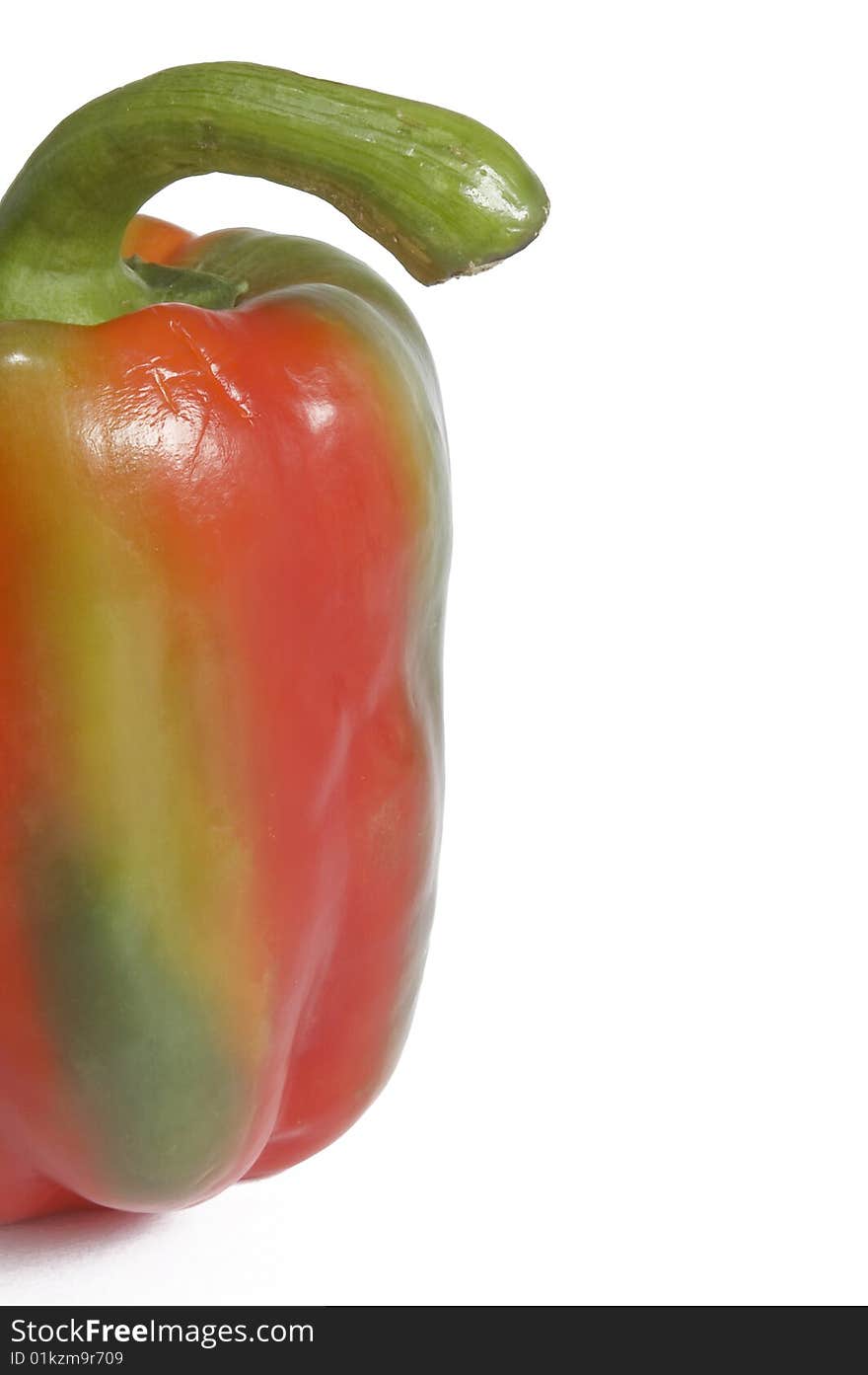 Single multi-colored - green and red pepper on white background. Horizontal image with clipping path and copy-space. Single multi-colored - green and red pepper on white background. Horizontal image with clipping path and copy-space.