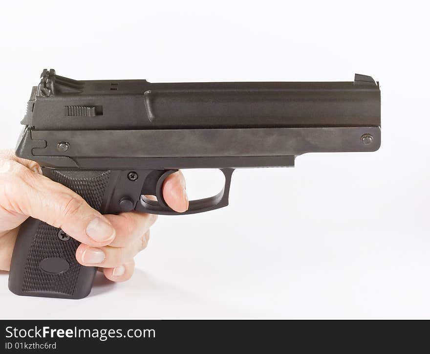 Pistol in hand on white background