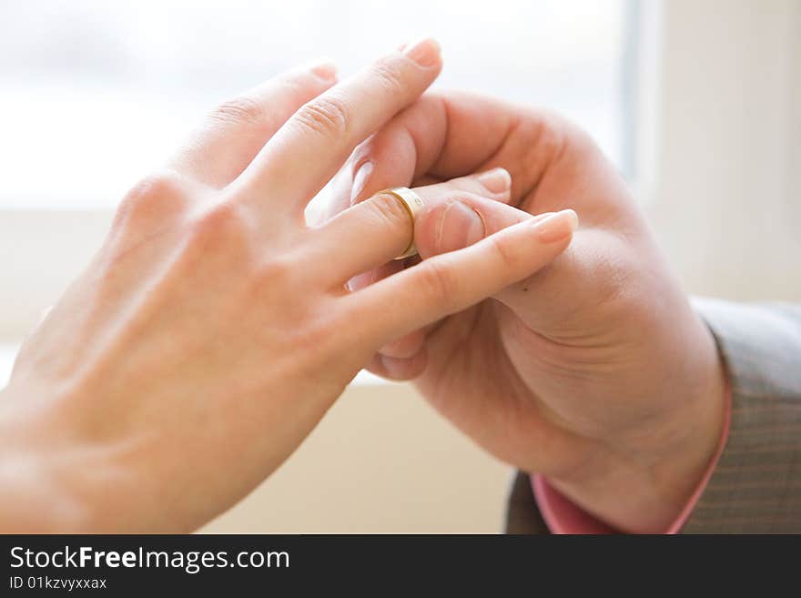 Wearing wedding ring to female finger. Wearing wedding ring to female finger