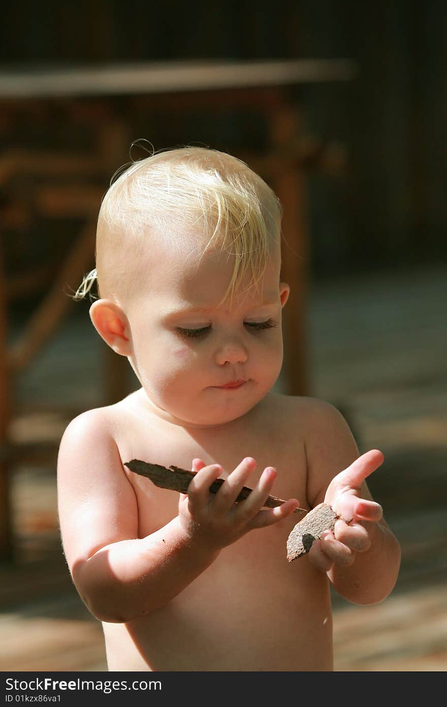 Baby Playing With Wood