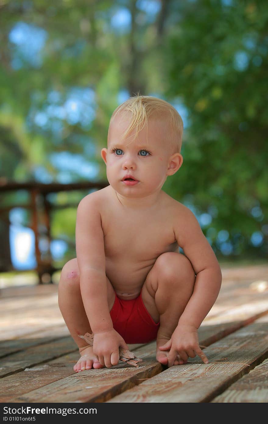 Baby playing on deck