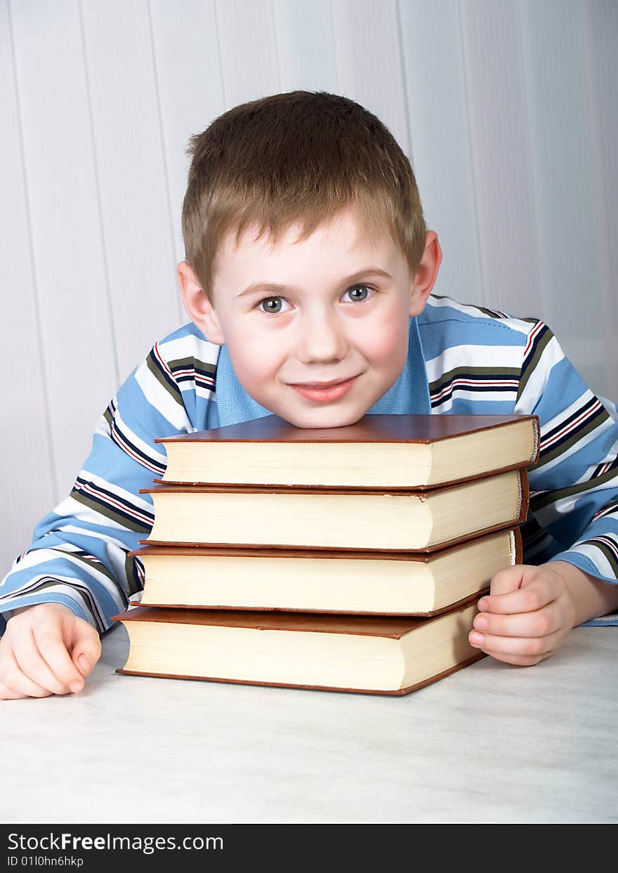 The child with books on the table