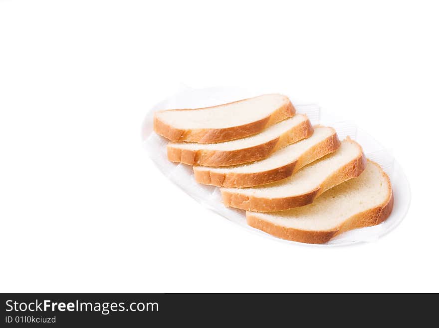 Sliced Bread on the plate isolated over white. Bon appetit!. Sliced Bread on the plate isolated over white. Bon appetit!